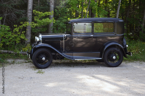 Antique auto on a country lane