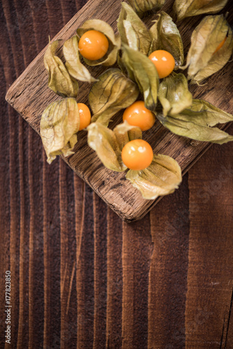Physalis fruits on wooden board
