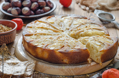 Pie with pear vegetarian with almond petals