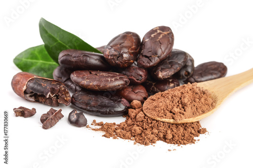 peeled cocoa bean with leaf and cocoa powder in wooden spoon isolated on white background
