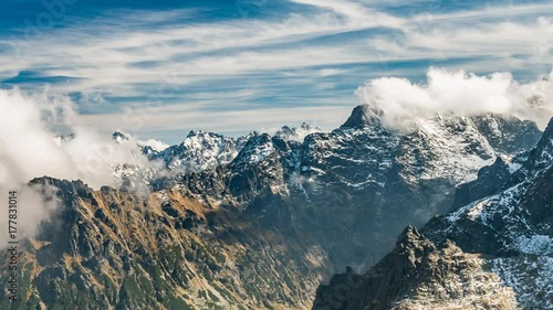 Snowy Tatra mountains peaks in clouds, Poland and Slovakia landscape, time lapse