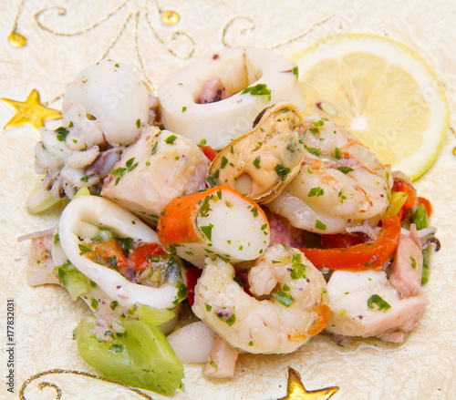 seafood salad on decorated dish photo