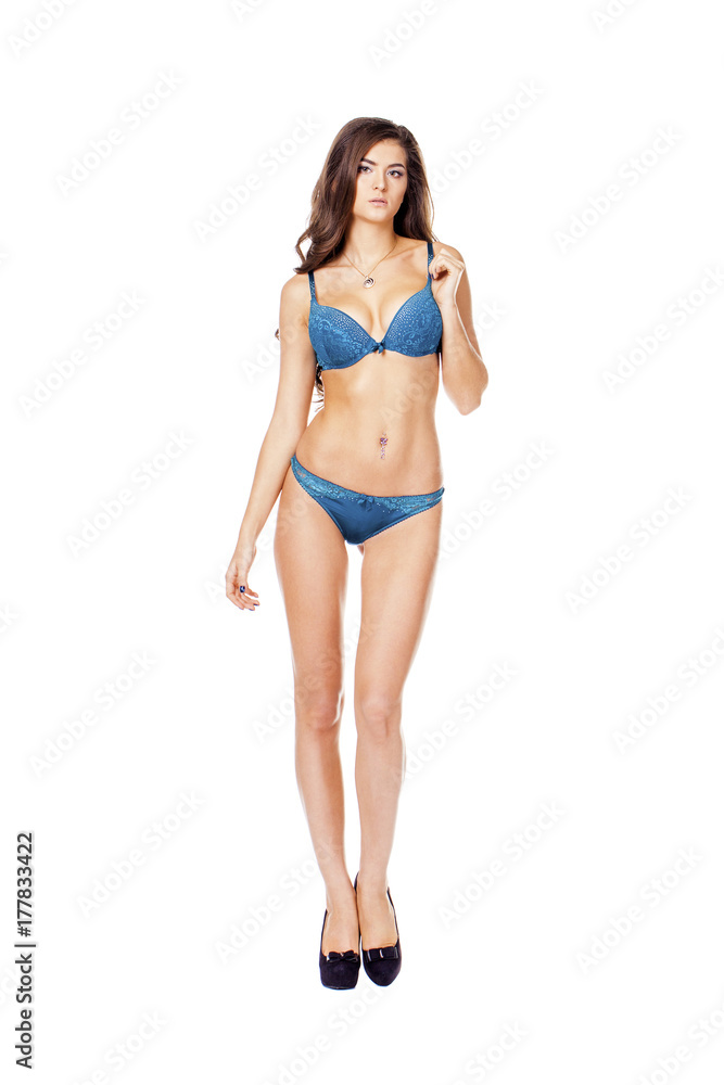 Full length beautiful slim tanned woman in bikini, isolated on white background Full length beautiful slim tanned woman in bikini, isolated on white background