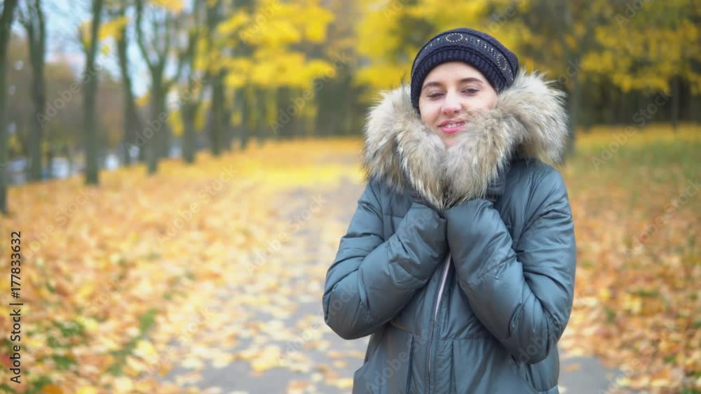 Portrait of a woman in an autumn park. Warm outerwear. Portrait of a woman in an autumn park. Warm outerwear.