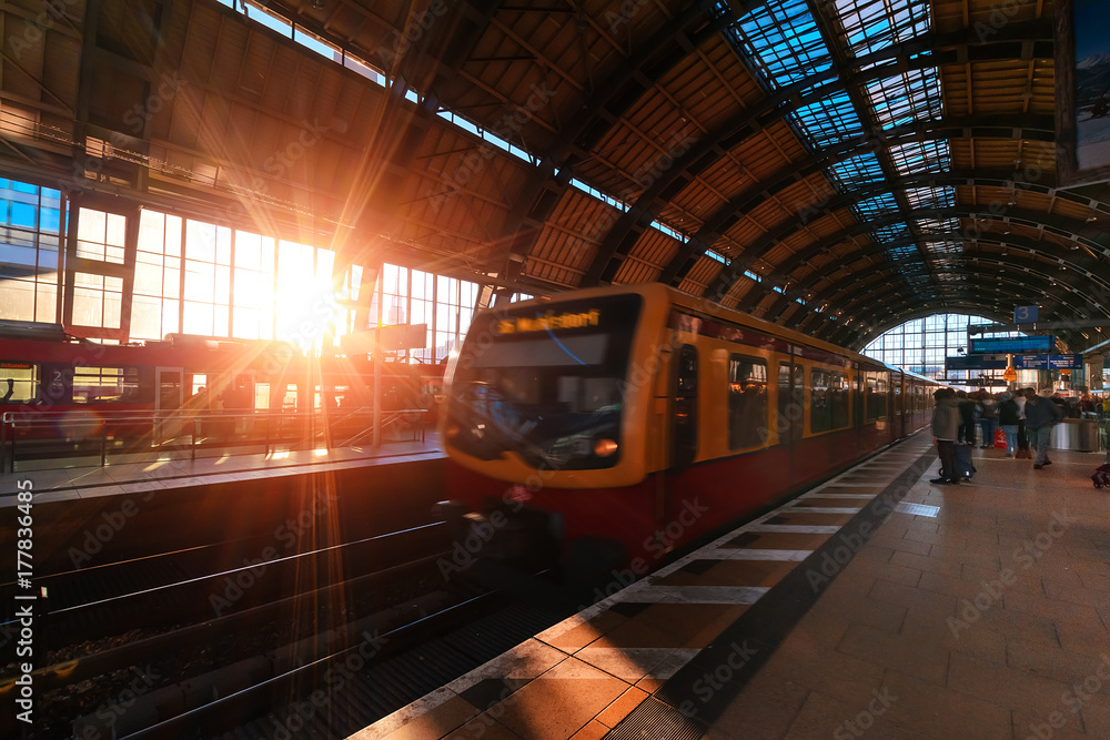 The Berliner railway U-Bahn in golden evening light at sunset.