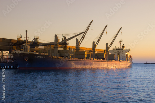 The cargo ship in the port.