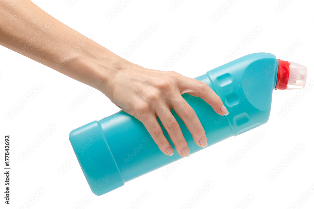 Bottle with toilet detergent household chemicals in a female hand