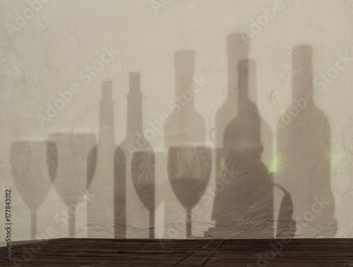 bottle and glass shadows on the walls