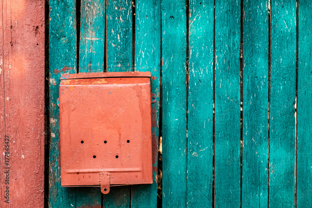 red mailbox on green boards red mailbox on green boards