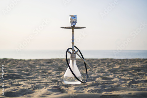 Hookah shisha smoke on beach background
