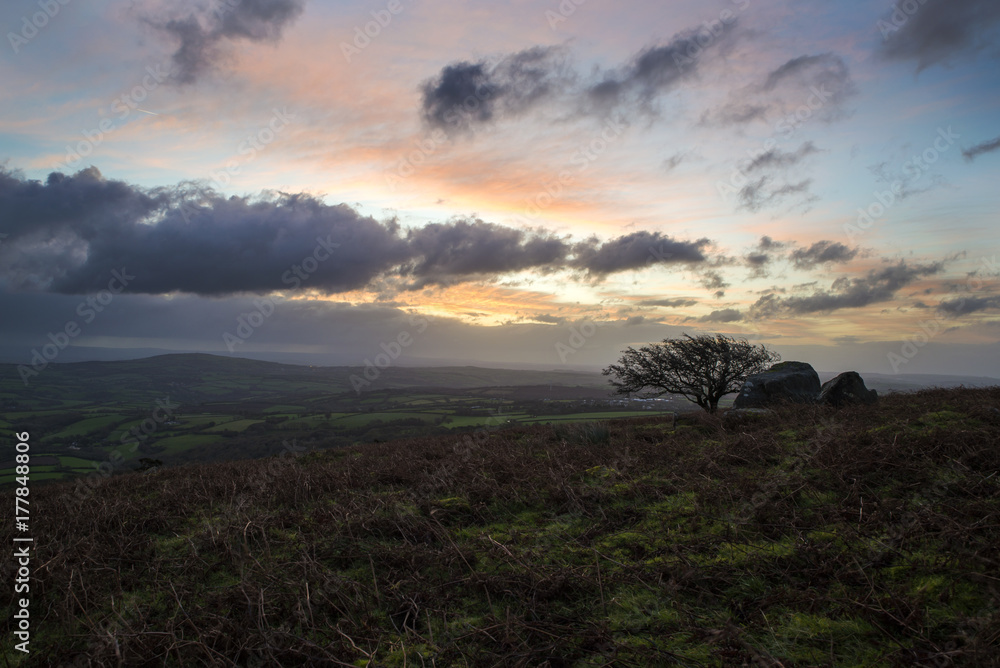 sunrise at caradon hill, cornwall, with cloudy dark sky and muted colours sunrise at caradon hill, cornwall, with cloudy dark sky and muted colours