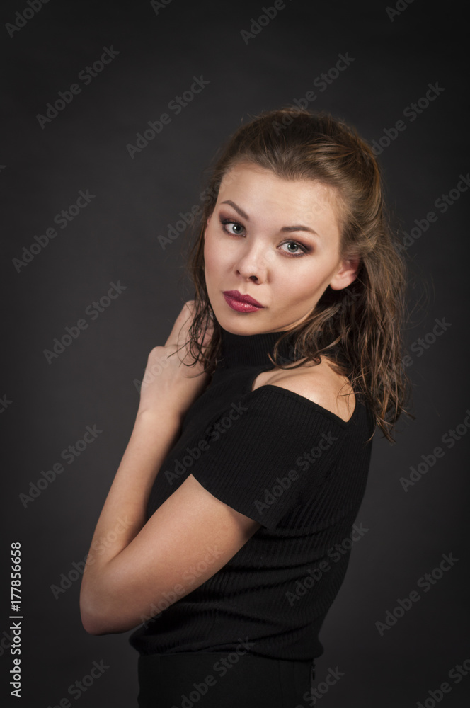 Portrait of a girl on a dark background. Portrait of a girl on a dark background.