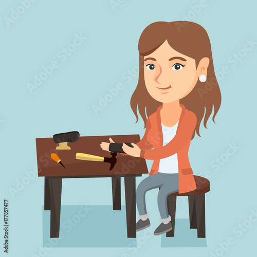 Caucasian shoemaker repairing a shoe in the workshop. Young shoemaker making handmade shoes in the workshop. Female shoemaker working in the workshop. Vector cartoon illustration. Square layout.