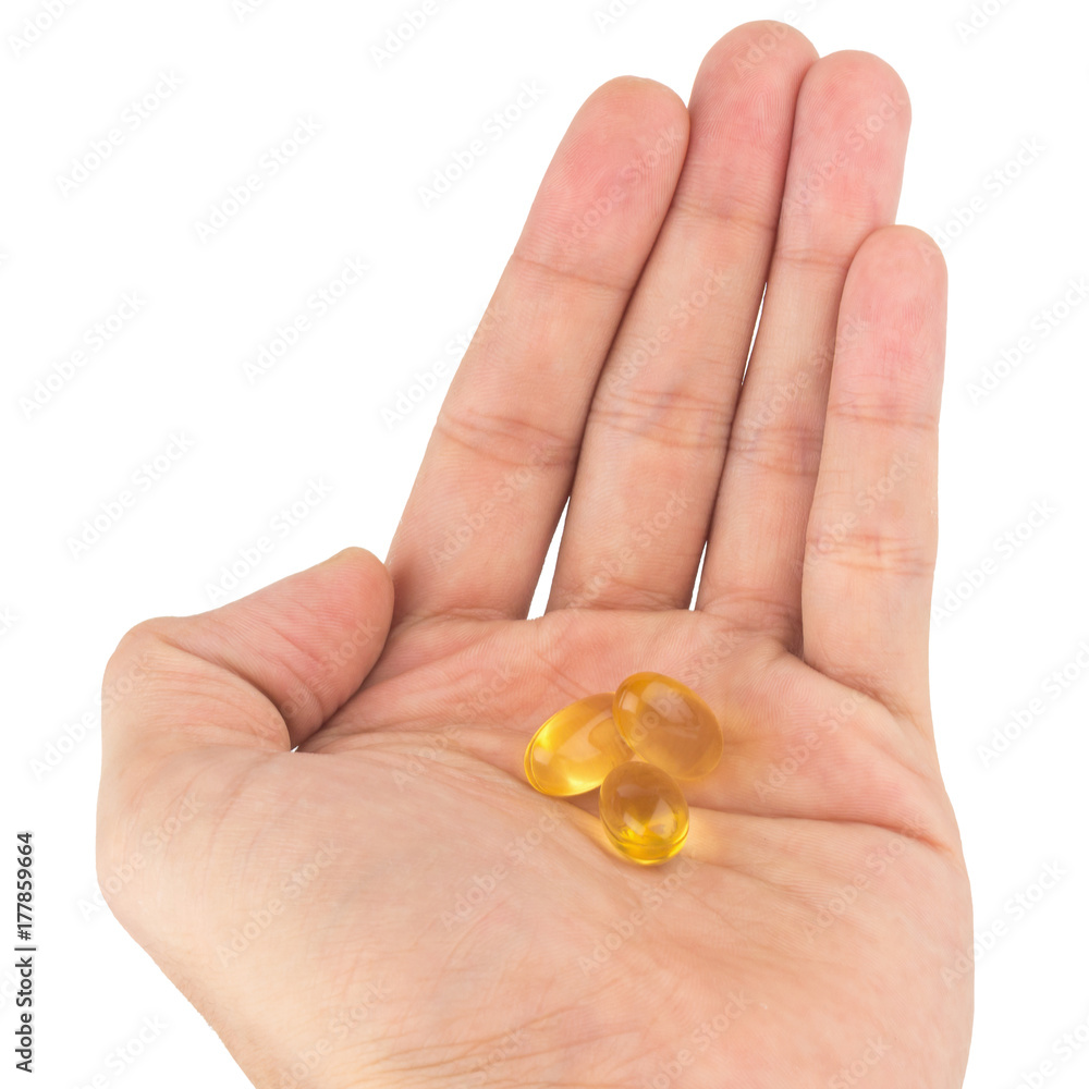 hold fish oil eating.Capsules fish oil isolate on white background hold fish oil eating.Capsules fish oil isolate on white background
