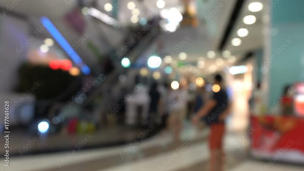 Blurred background with many people walking into the supermarket scene Blurred background with many people walking into the supermarket scene