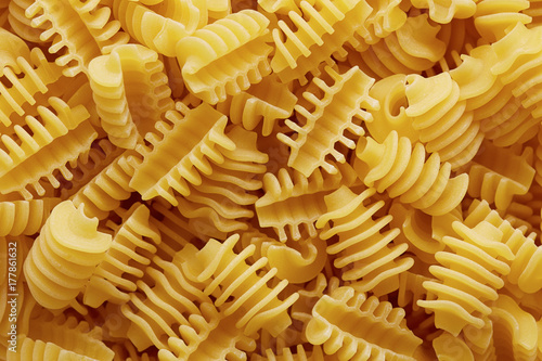 Raw radiatori pasta texture photo