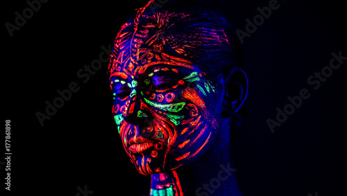 Neon girl in black light photo