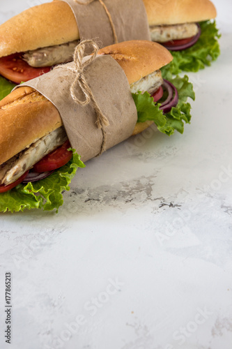 Sandwich with fried fish and vegetables. Balik ekmek - turkish fast food, copy space