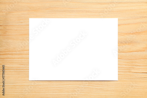 blank white card on wood background