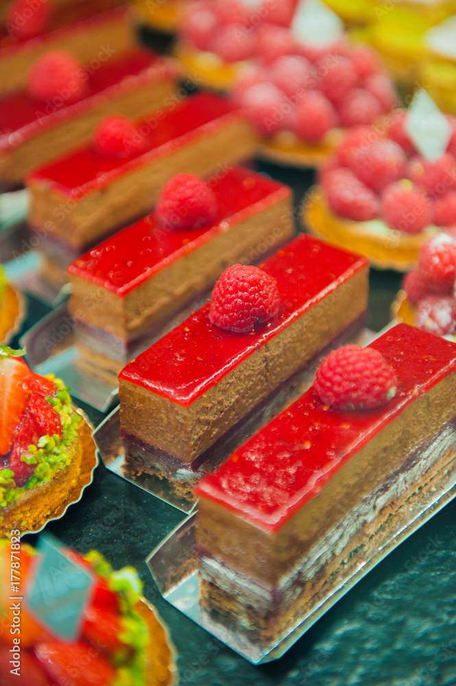 Delicious french cakes with berries and chocolate Delicious french cakes with berries and chocolate