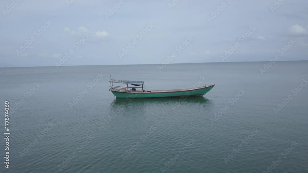 Orbiting around a fishing or tourist boat in southeast asia off an island paradise. Orbiting around a fishing or tourist boat in southeast asia off an island paradise.