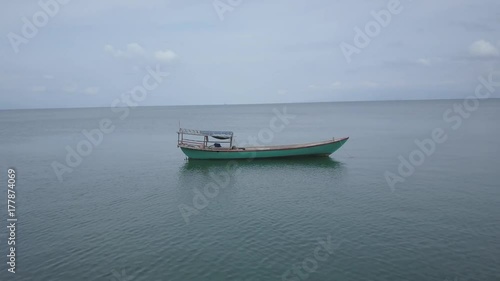 Wallpaper Mural Orbiting around a fishing or tourist boat in southeast asia off an island paradise. Torontodigital.ca