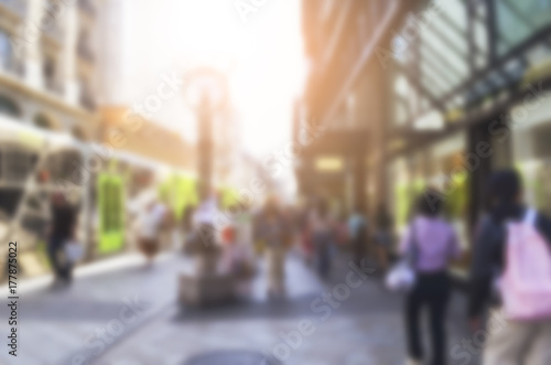 People meeting and walking on the street in the city and outdoor restaurant space, business and lifestyle with building and city. Blurred Background Concept.