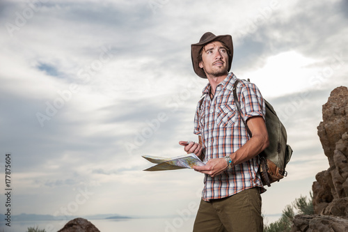 Rugid Hiker Using Map and Compass photo