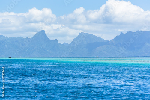 Tahiti in Polynesia, beautiful panorama of the mountains and the barrier reef from the sea 