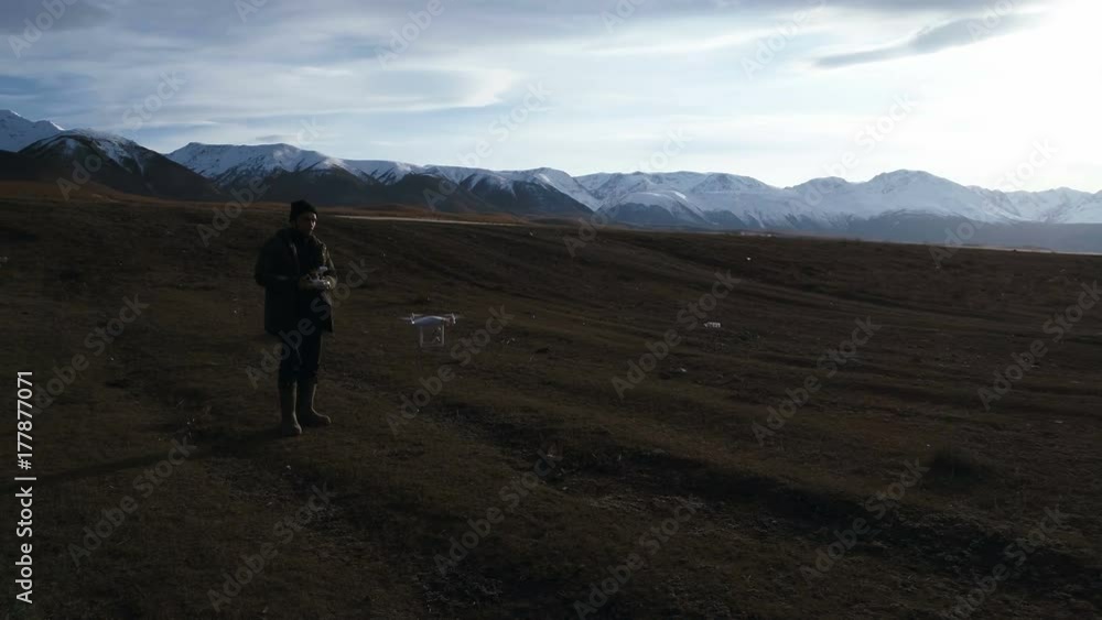 Man manages quadrocopters. Remote control for the drone in the hands of men. Unmanned aerial vehicle. Man manages quadrocopters. Remote control for the drone in the hands of men. Unmanned aerial vehicle.