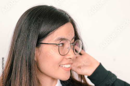Portrait headshot of a Young asian Student woman wearing glasses