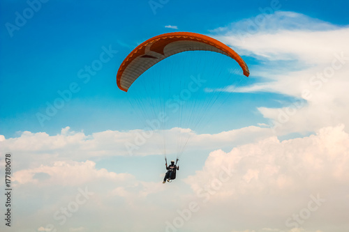 Paragliding in the blue sky
