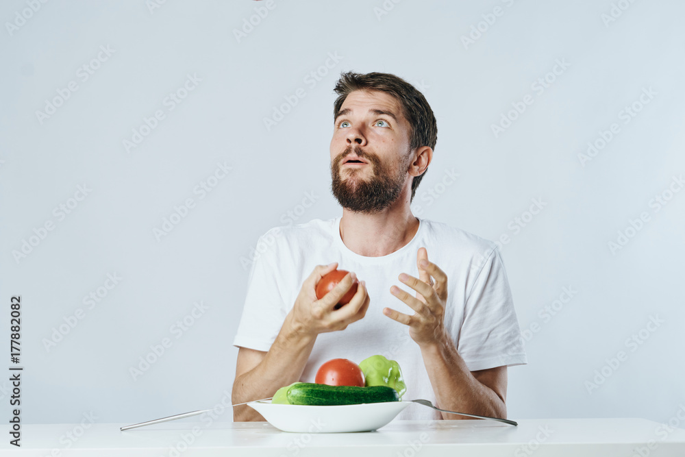man with a full plate of vegetables happy man with a full plate of vegetables happy