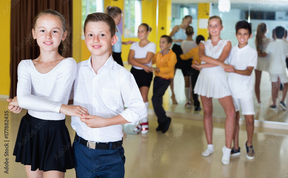 Group of  children dancing tango in dance studio