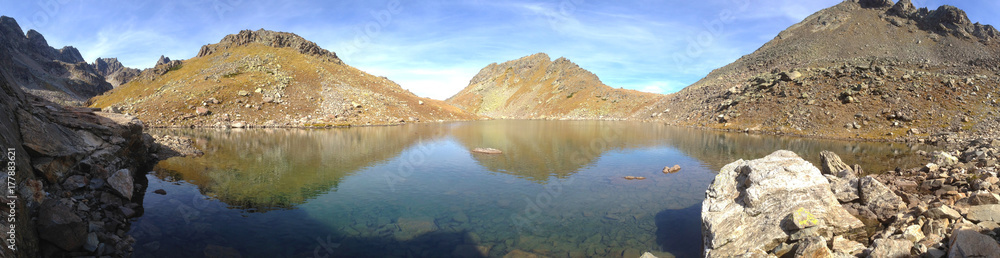 A beautiful panorama of an alpine lake at an altitude of 2,800 meters above sea level in an archipelago