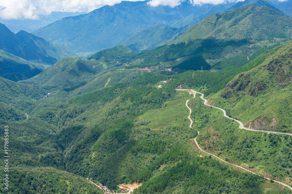 Aerial view of winding mountain road and magnificent valley