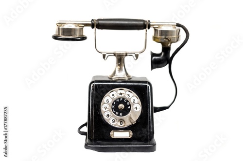 Old phone against white isolated background