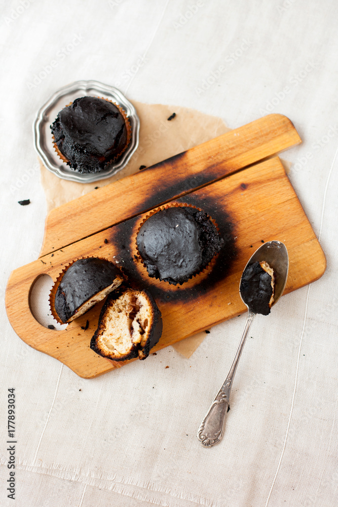 burned muffins - black cupcakes, failed baking, catastrophe in the kitchen, burned on charcoal