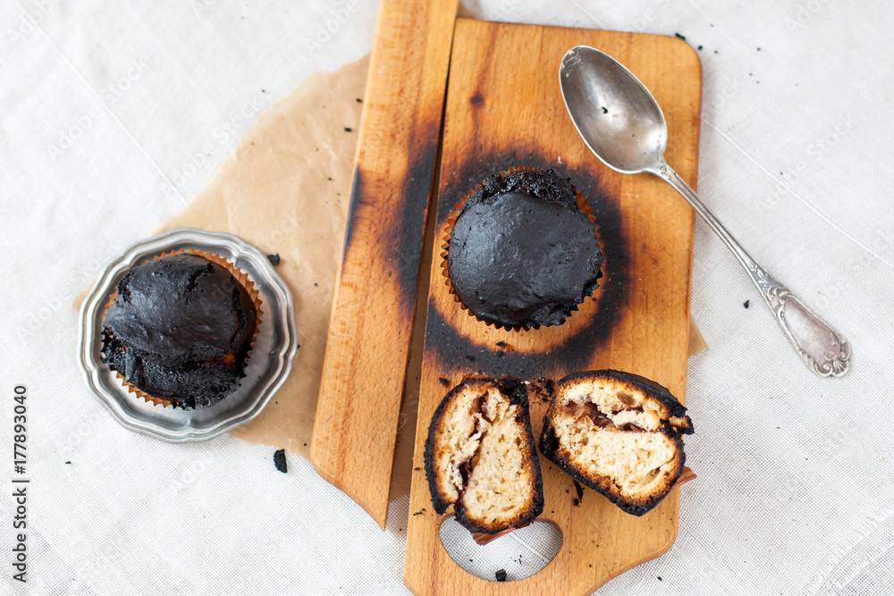 burned muffins - black cupcakes, failed baking, catastrophe in the kitchen, burned on charcoal