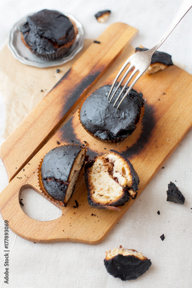 burned muffins - black cupcakes, failed baking, catastrophe in the kitchen, burned on charcoal