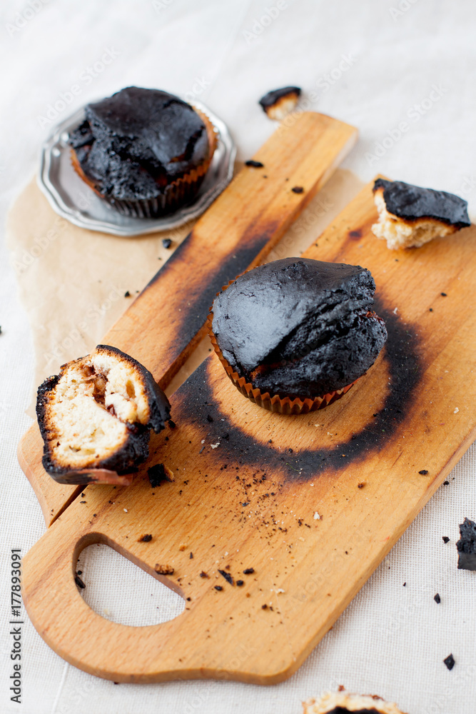 burned muffins - black cupcakes, failed baking, catastrophe in the kitchen, burned on charcoal