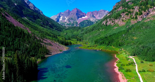 Jagged Mountain Peak Framed By Green Valley With Lake - Maroon Bells, Colorado, USA