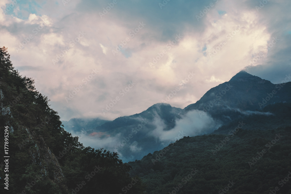 Cloudscape over mountain ridge.