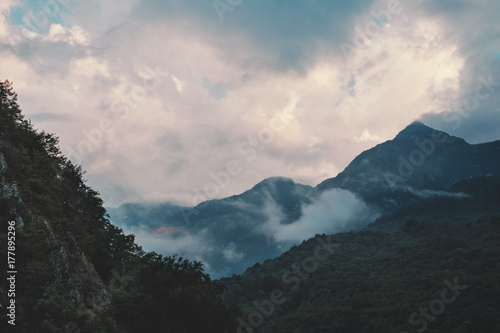 Cloudscape over mountain ridge. © Alex Photo