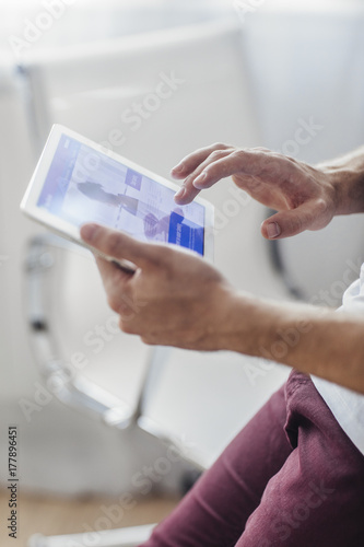 Man Holding Tablet