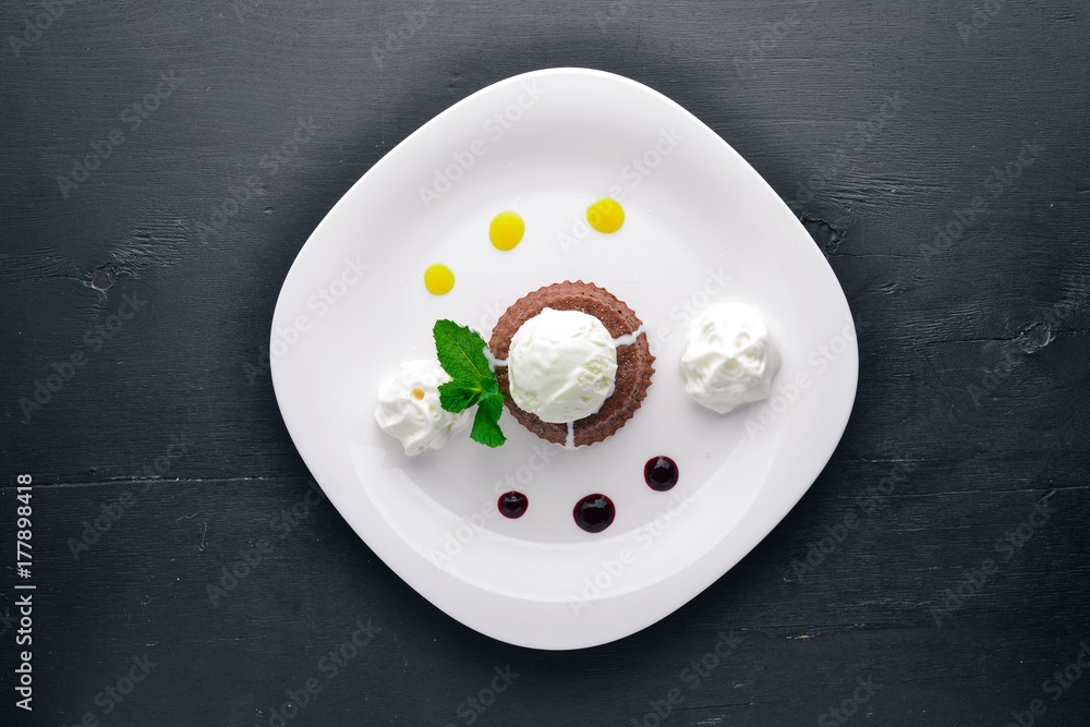 Chocolate Cake Dessert with Ice Cream. On a wooden background. Top view. Free space for your text. Chocolate Cake Dessert with Ice Cream. On a wooden background. Top view. Free space for your text.