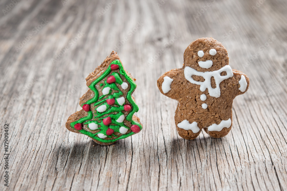 Gingerman and Christmas tree made of gingerbread dough as backgorund Gingerman and Christmas tree made of gingerbread dough as backgorund