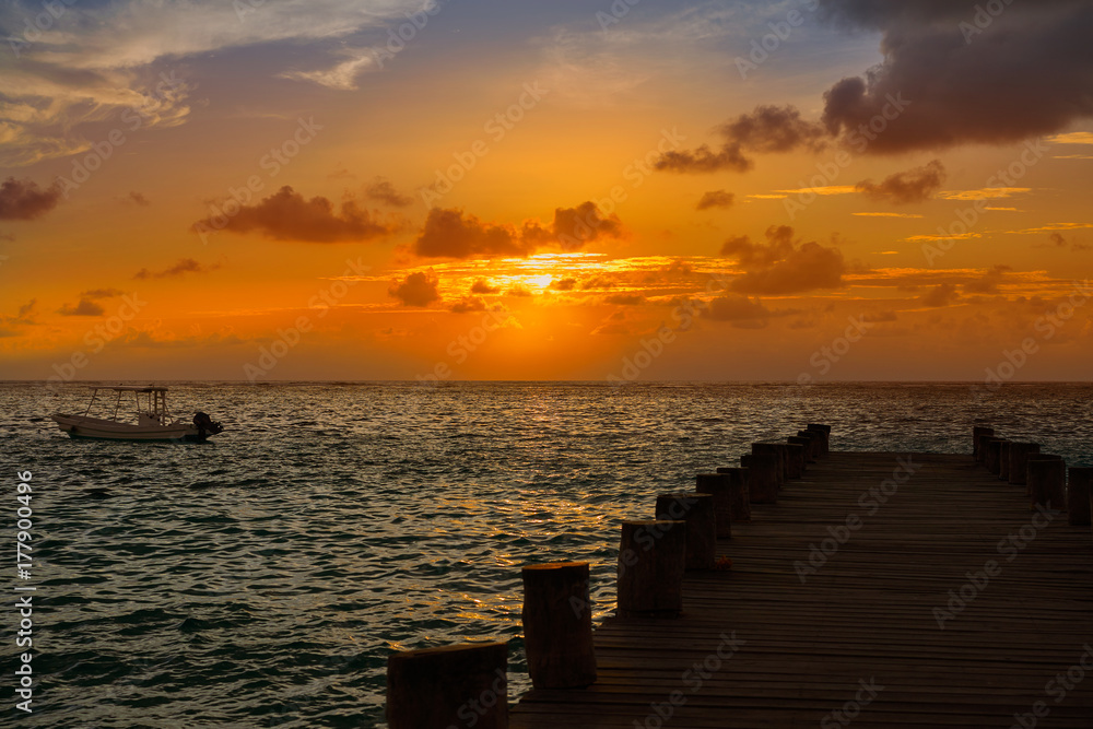 Riviera Maya pier sunrise in Caribbean Mayan