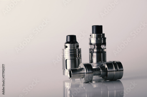 isolated vape tanks for electronic cigarette or e cig over a white background. vaping heads.