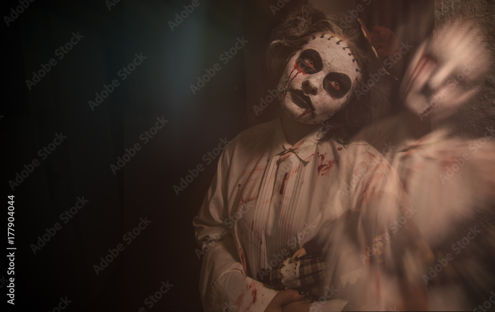 Horror movie scene of a scary woman with bloody doll Stock Photo | Adobe  Stock